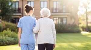 Family members review assisted living information beside a senior using a comparison checklist.